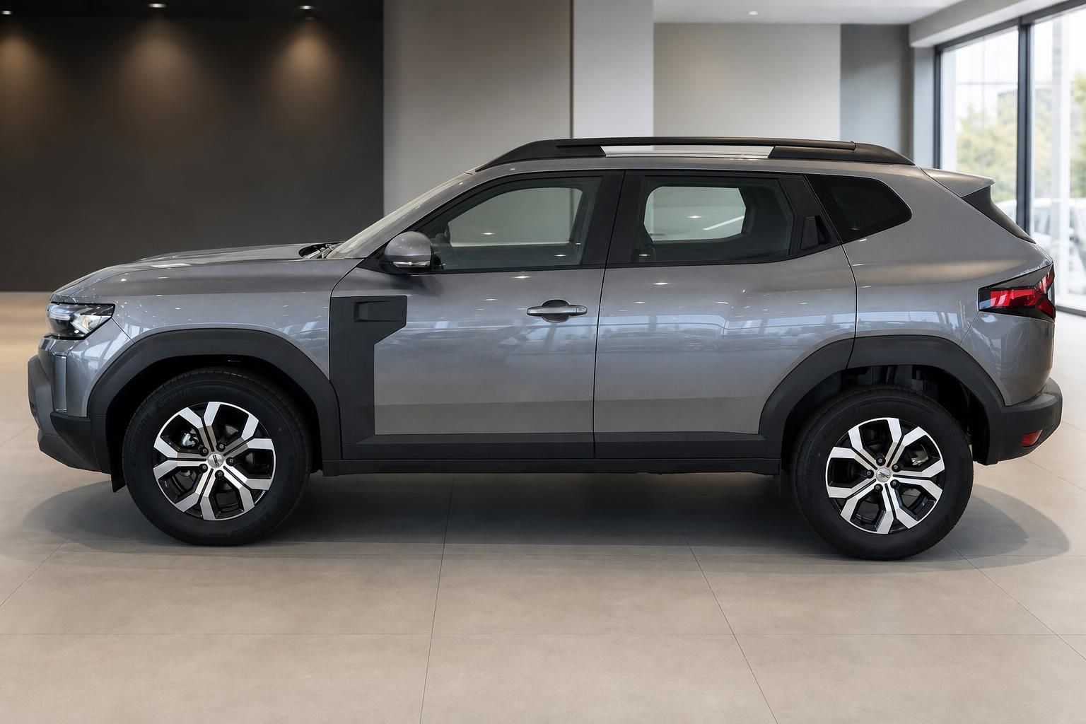 Dacia Duster SUV grau Seitenansicht links im Autohaus