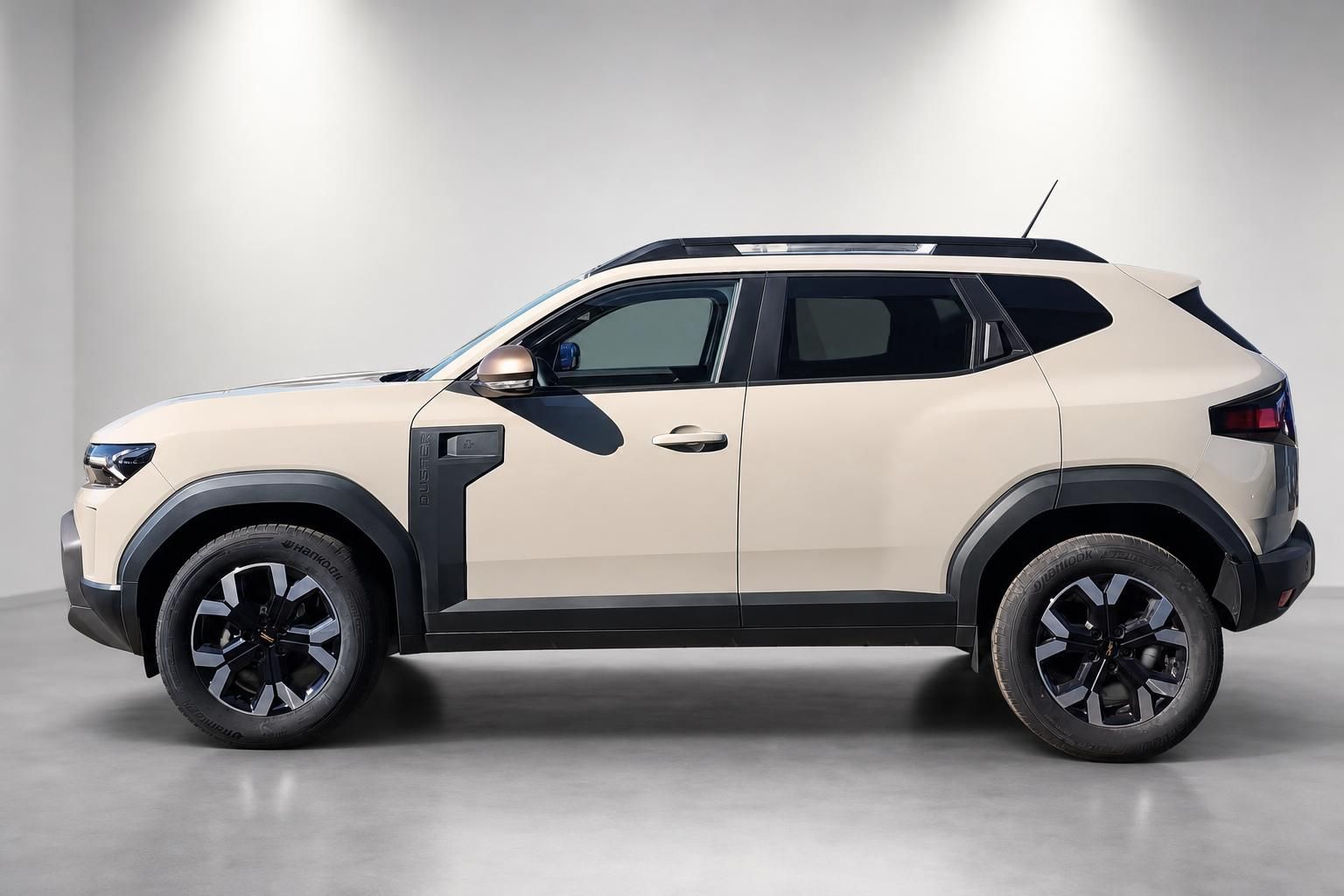 Dacia Duster Neuwagen beige Seitenansicht mit robusten Felgen