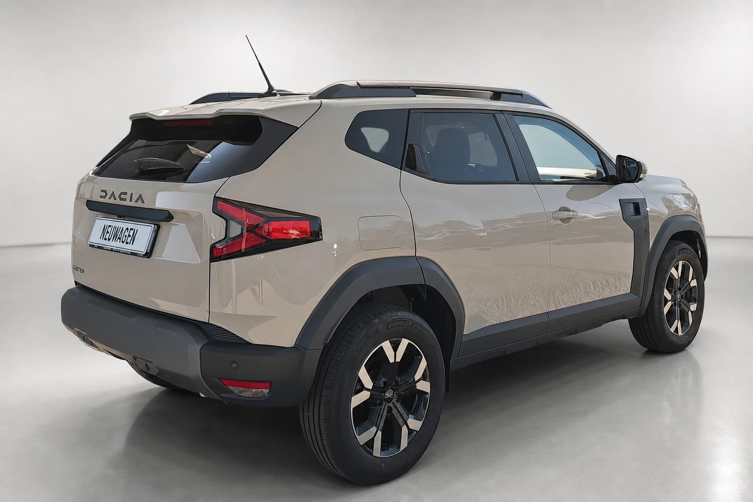 Dacia Duster Neuwagen Seiten-Heckansicht in Beige metallic