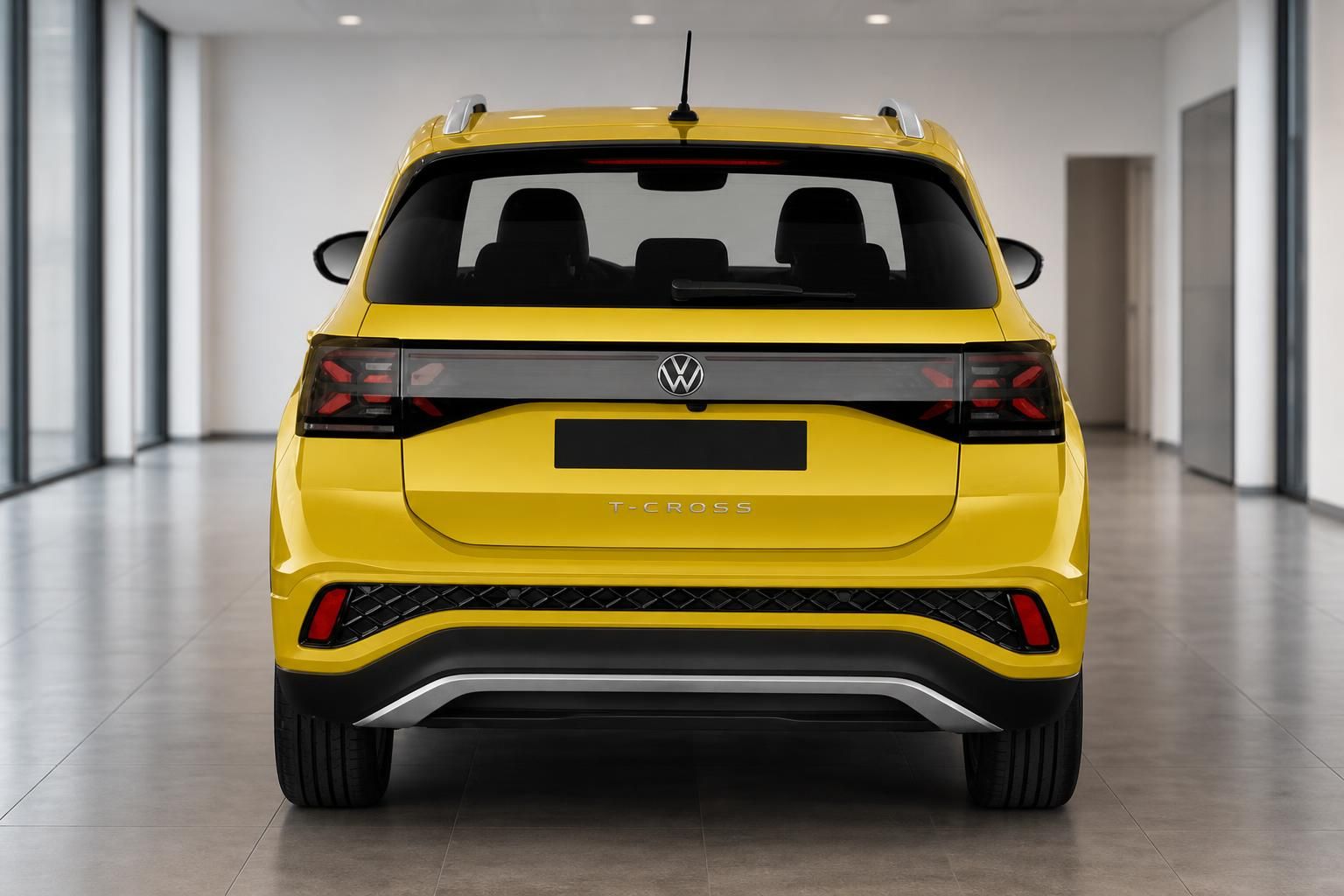 VW T-Cross Heckansicht in gelb mit LED-Rückleuchten und schwarzem Kennzeichen-Bereich