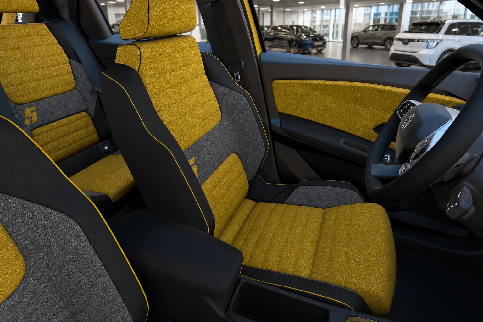 Renault 5 Vordersitze in Gelb-Schwarz mit Lenkrad im Detail
