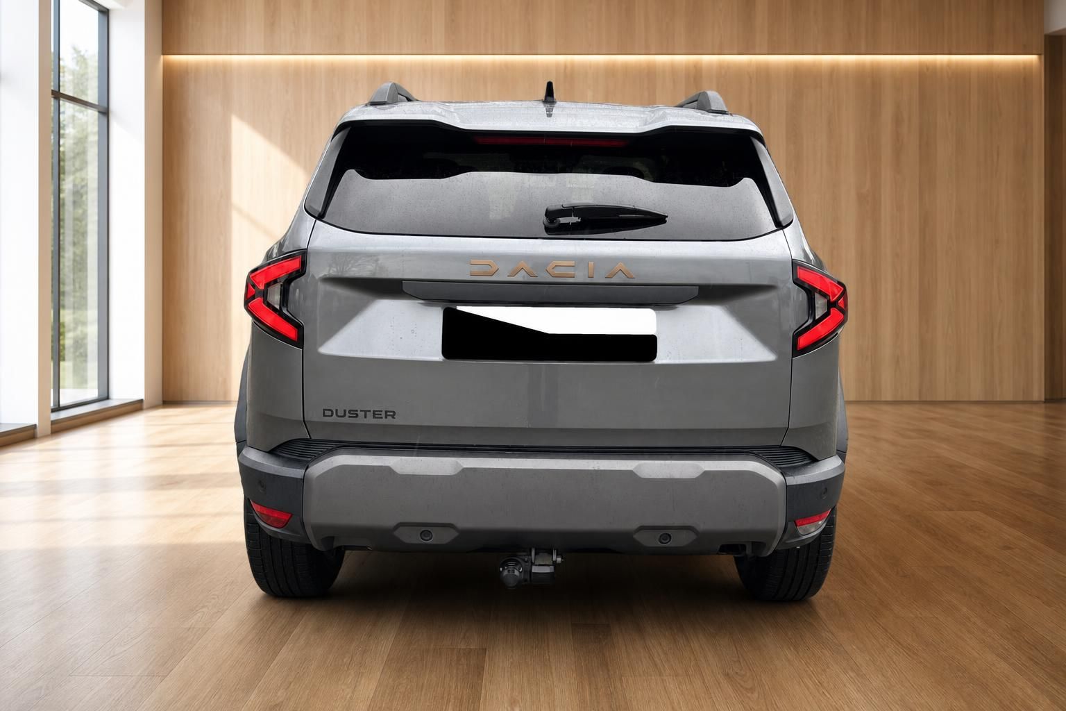 Dacia Duster grau gerade Heckansicht mit Anhängerkupplung und Dacia-Schriftzug