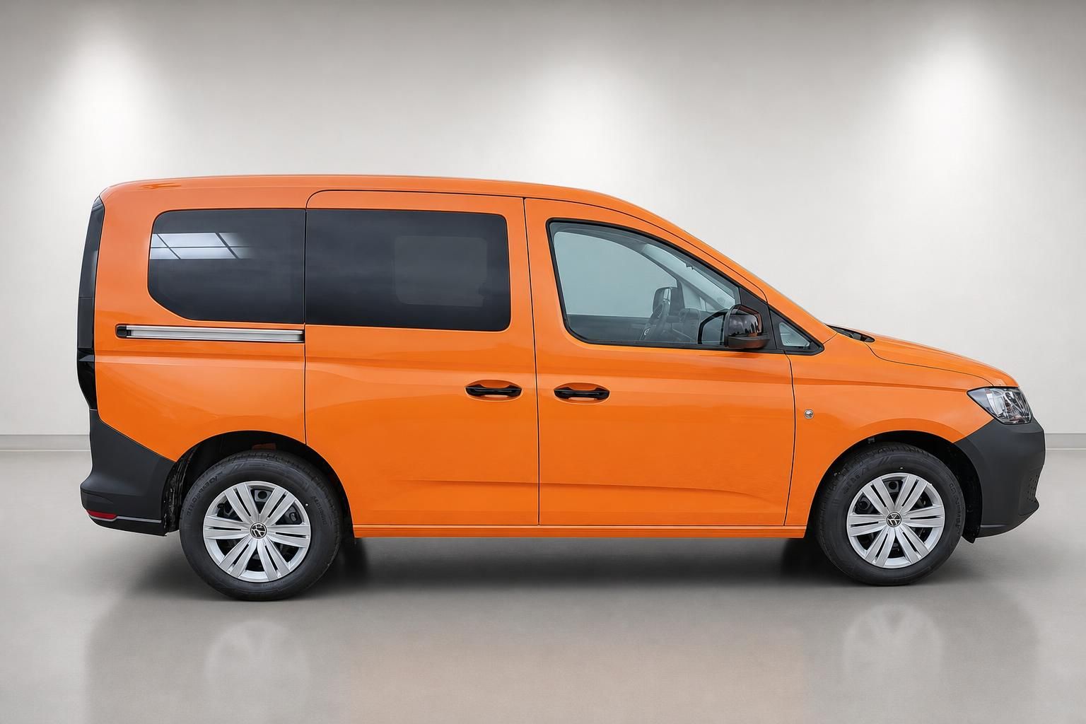 VW Caddy Orange, Seitenansicht komplett