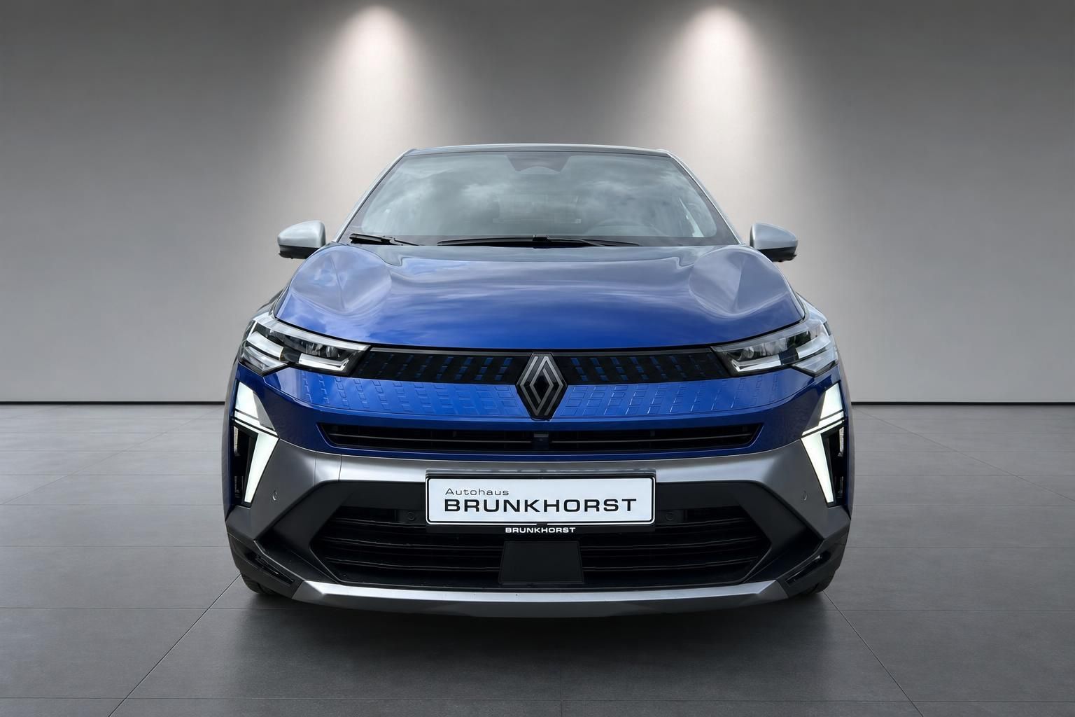 Renault Captur E-Tech Frontansicht in Blau - Elektro-SUV mit charakteristischem Renault-Design