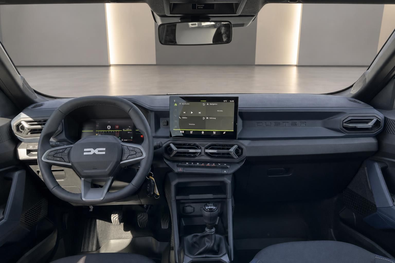 Dacia Innenraum mit Lenkrad, Touchscreen und Armaturenbrett in grau