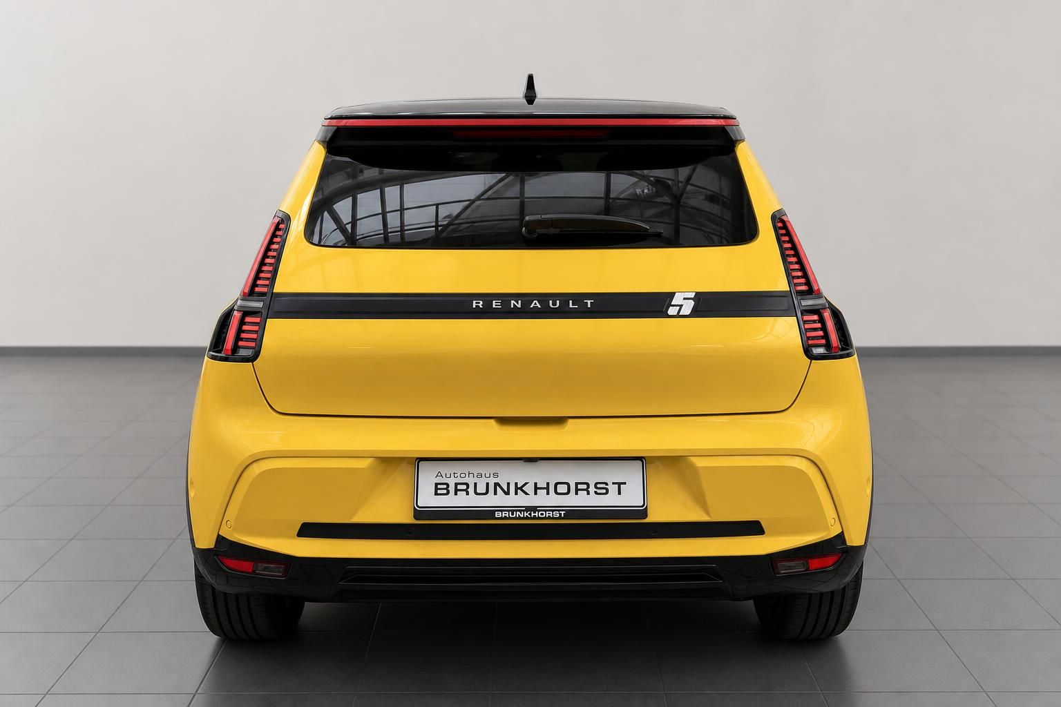 Renault 5 E-Tech Electric gelb Heckansicht mit LED-Rückleuchten