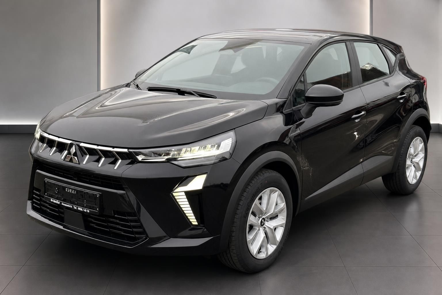 Mitsubishi Colt schwarz Frontansicht schräg links Dreiviertelansicht