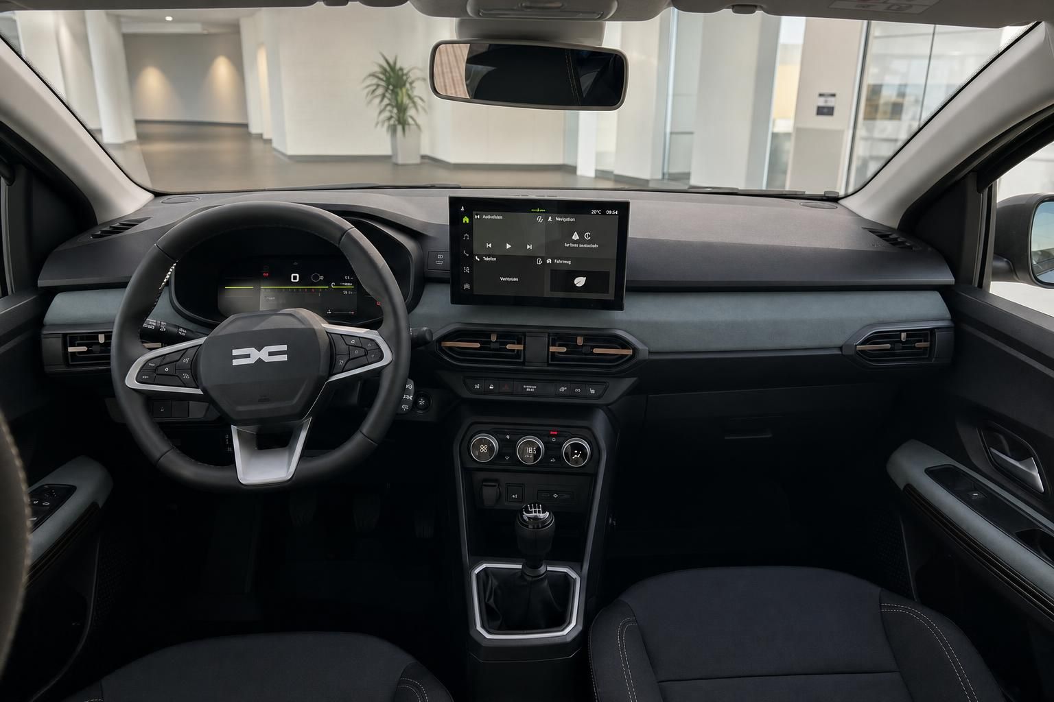 Dacia Cockpit mit Lenkrad, Touchscreen und Armaturenbrett im Fokus