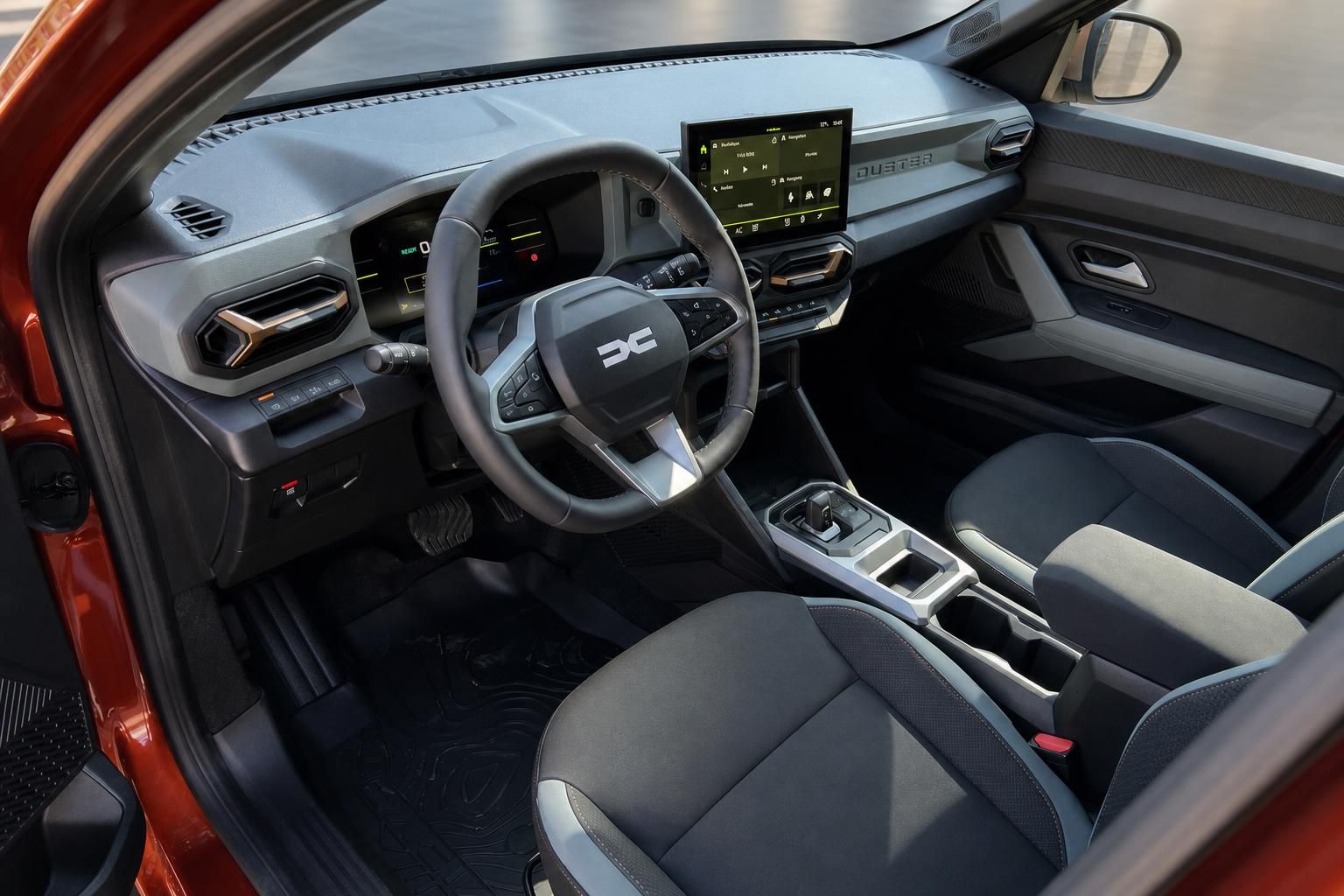Dacia SUV Innenraum mit schwarzer Ausstattung, Lenkrad und Touchscreen-Display