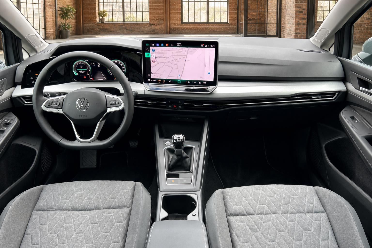 VW Innenraum Frontansicht mit Lenkrad und Infotainment