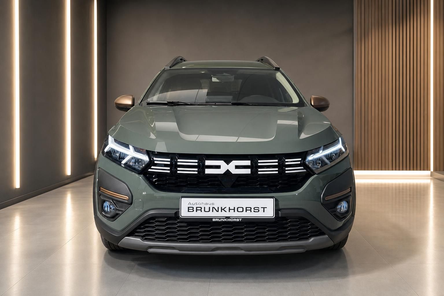 Dacia Jogger Hybrid grün metallic - Frontansicht mit modernem LED-Design bei Autohaus Brunkhorst