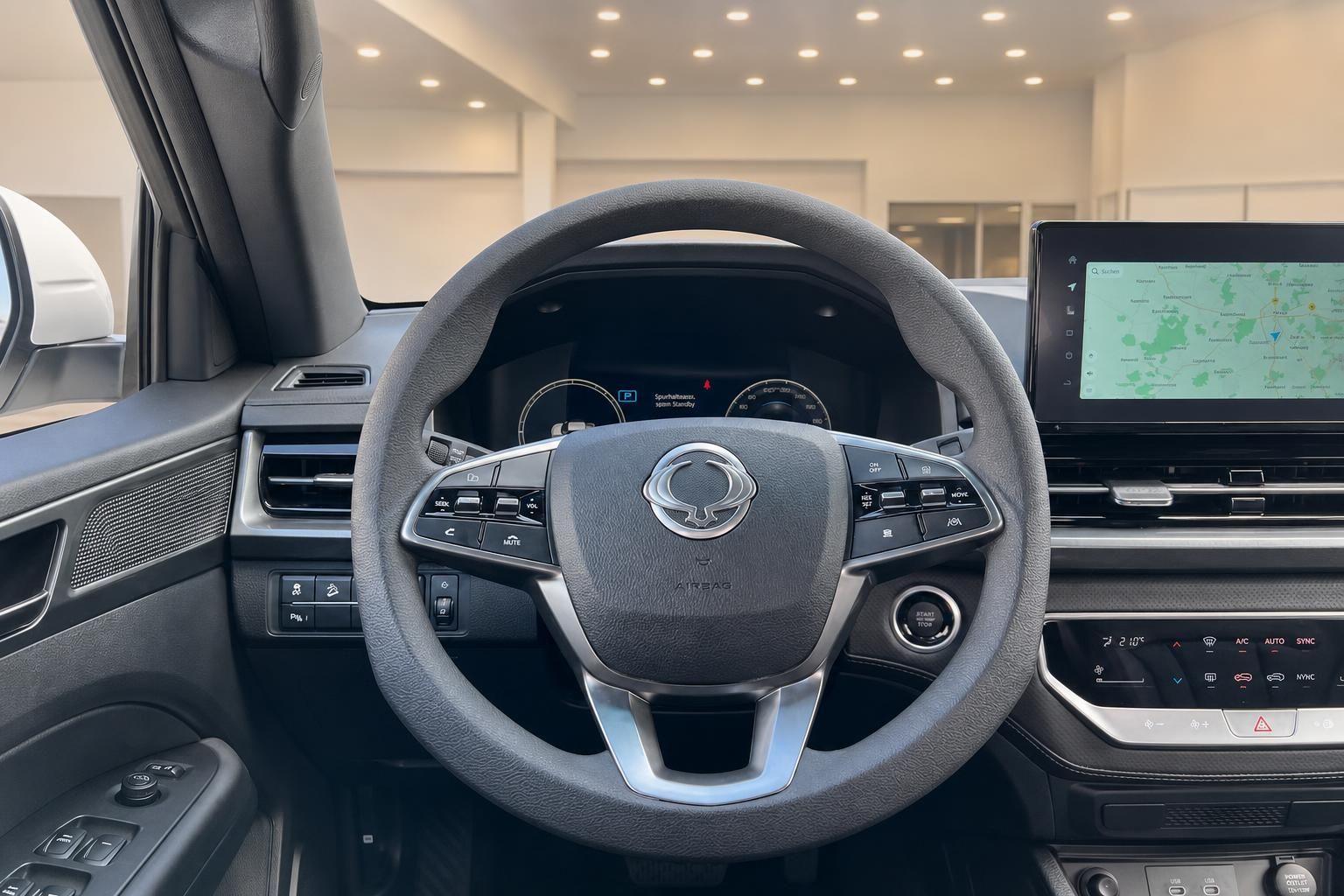 Fahrzeug Cockpit mit Lenkrad, Armaturenbrett und Infotainment-Display im modernen Design