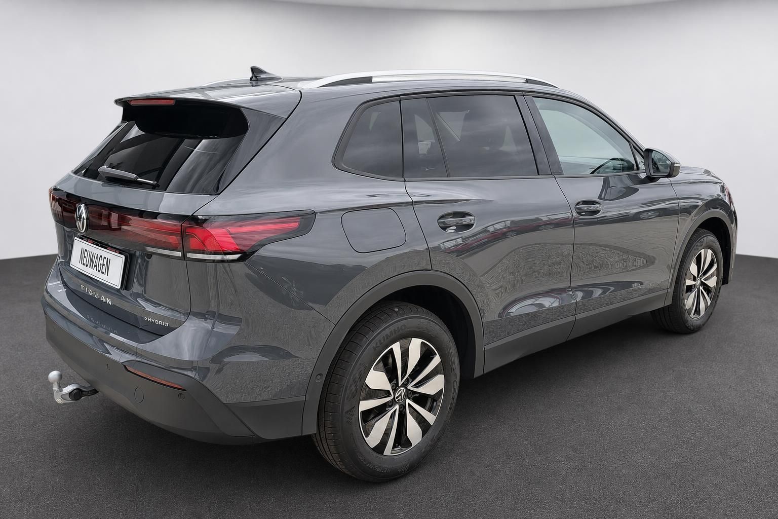 VW Tiguan eHybrid grau Heck-Seitenansicht mit Dachreling