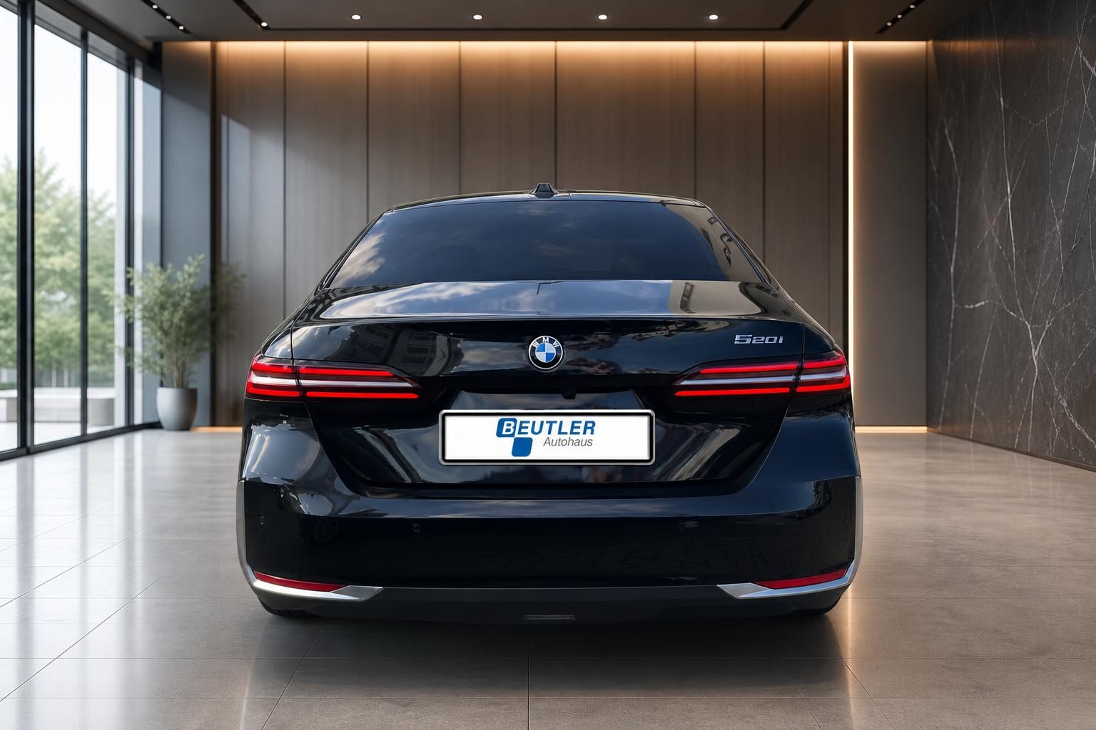 BMW 520i schwarz Heckansicht mit Rueckleuchten im Showroom