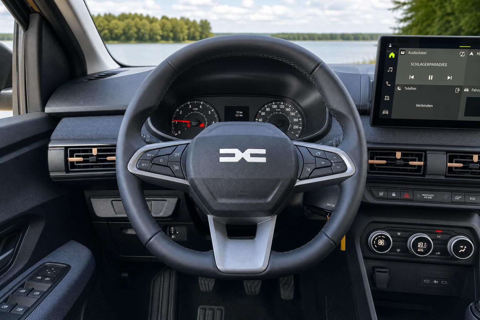 Fahrzeug Cockpit mit Lenkrad, Tacho und Infotainment-System - modernes Armaturenbrett