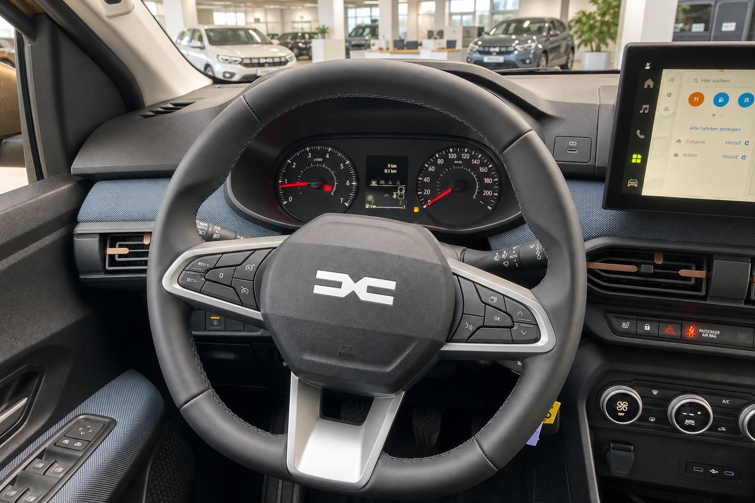 Fahrzeug-Cockpit mit Lenkrad, Armaturenbrett und Navigationssystem