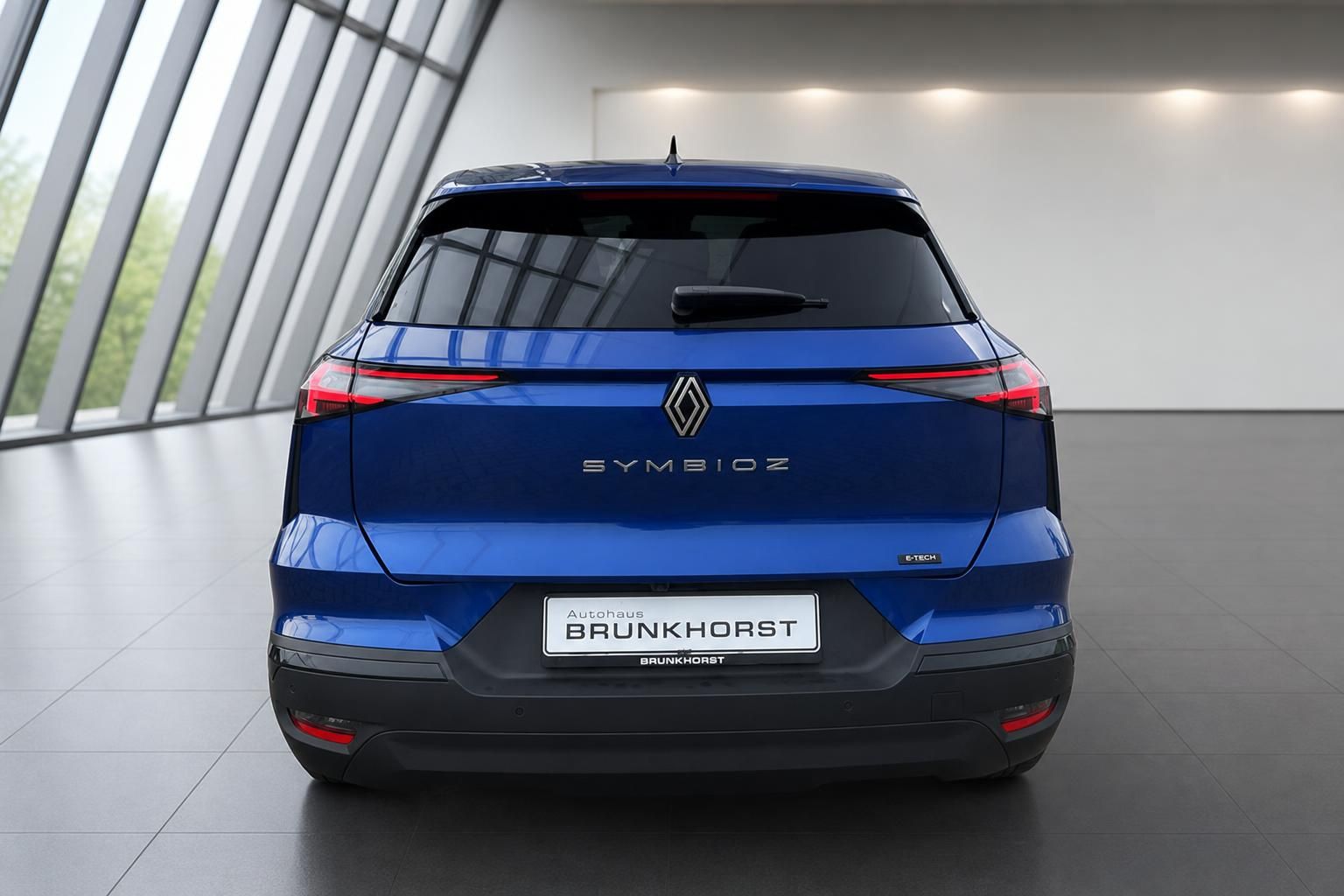 Renault Symbioz E-Tech Elektro-SUV in blau - Heckansicht mit LED-Rückleuchten und Autohaus Brunkhorst Kennzeichen