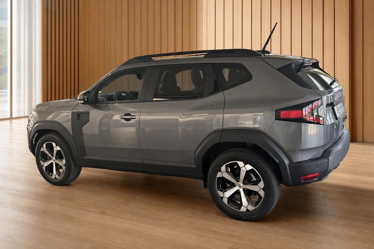 Dacia Duster SUV grau Heckansicht schräg rechts mit Leichtmetallfelgen