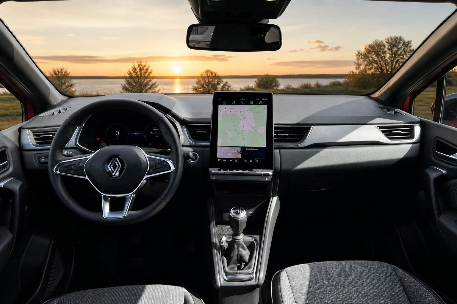 Renault Captur Armaturenbrett - Innenansicht mit Navigationssystem und Sonnenuntergang-Panorama