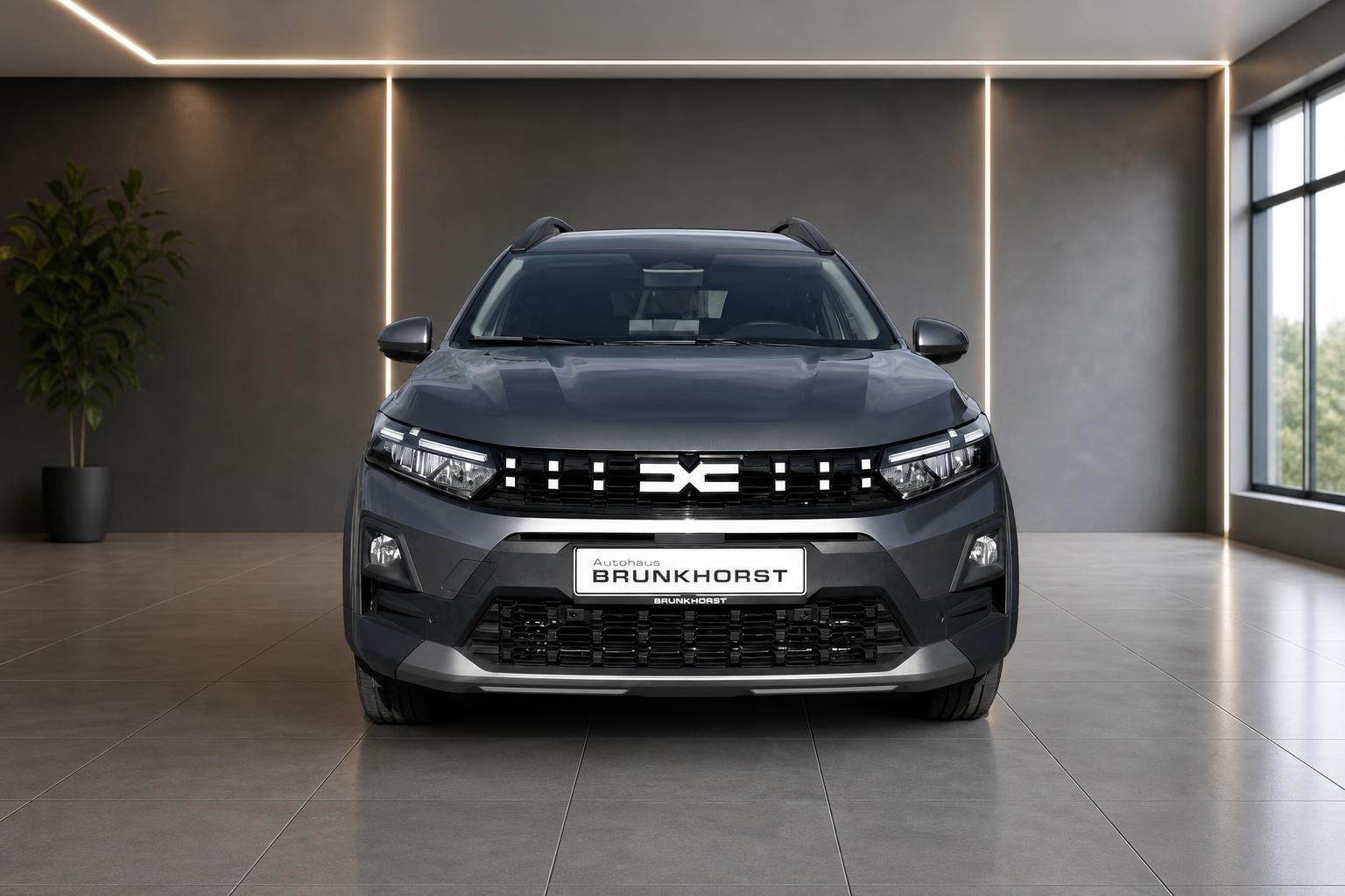 Dacia SUV grau Frontansicht im Autohaus Brunkhorst Showroom
