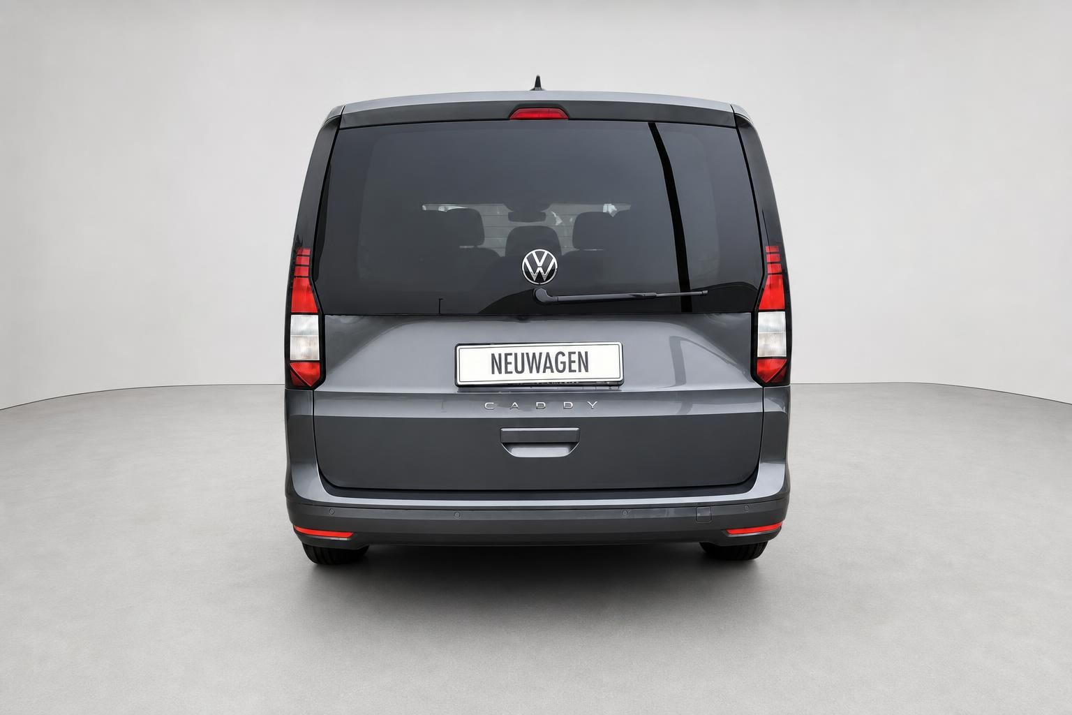 VW Caddy Heckansicht in Grau mit geschlossener Heckklappe