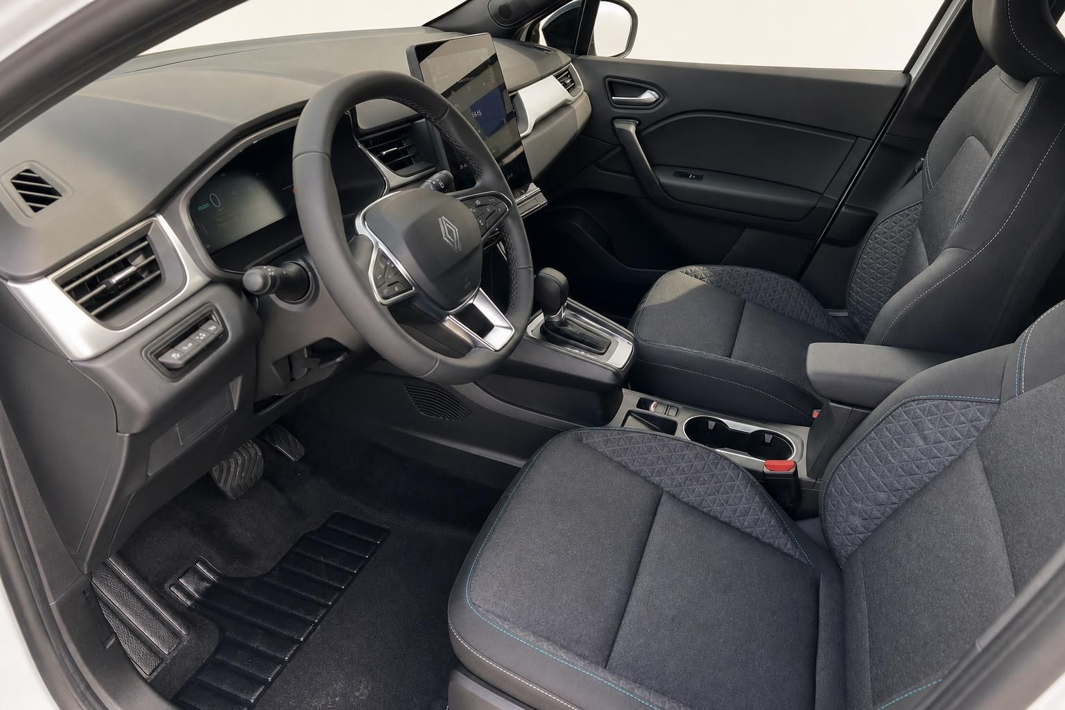Renault Symbioz E-Tech Innenraum vorne - Fahrersitz, Lenkrad und Mittelkonsole in grau