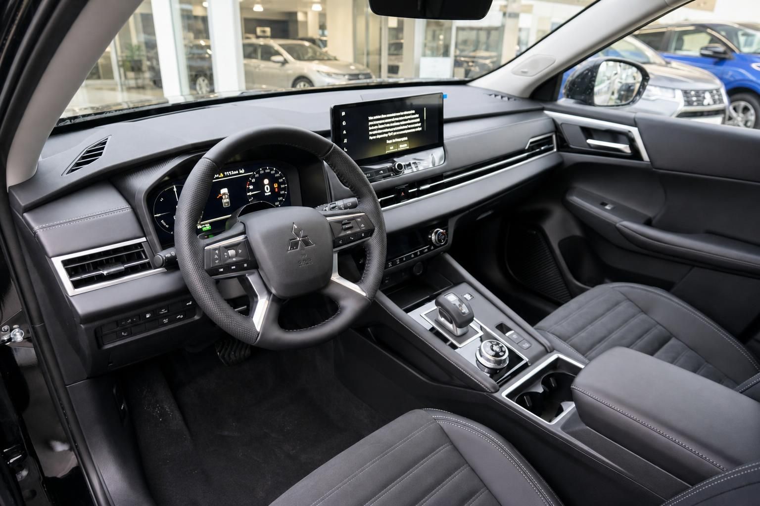 Cockpit mit Lenkrad, Digitalanzeigen und Touchscreen-Display