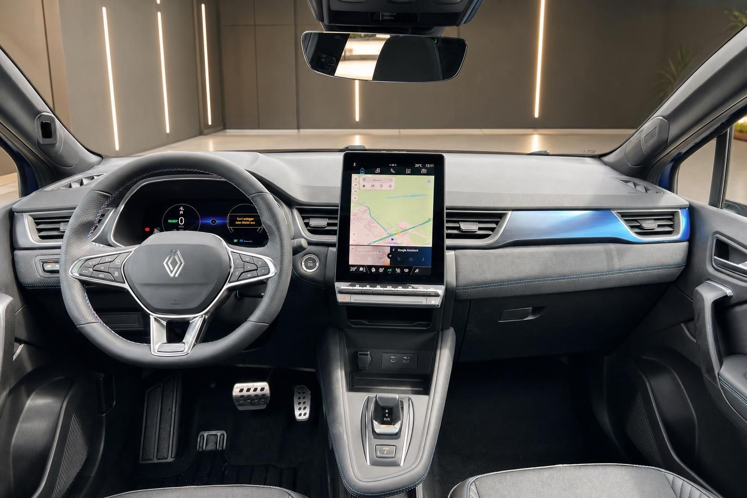 Renault Innenraum mit Lenkrad, digitalem Touchscreen und modernem Cockpit-Design