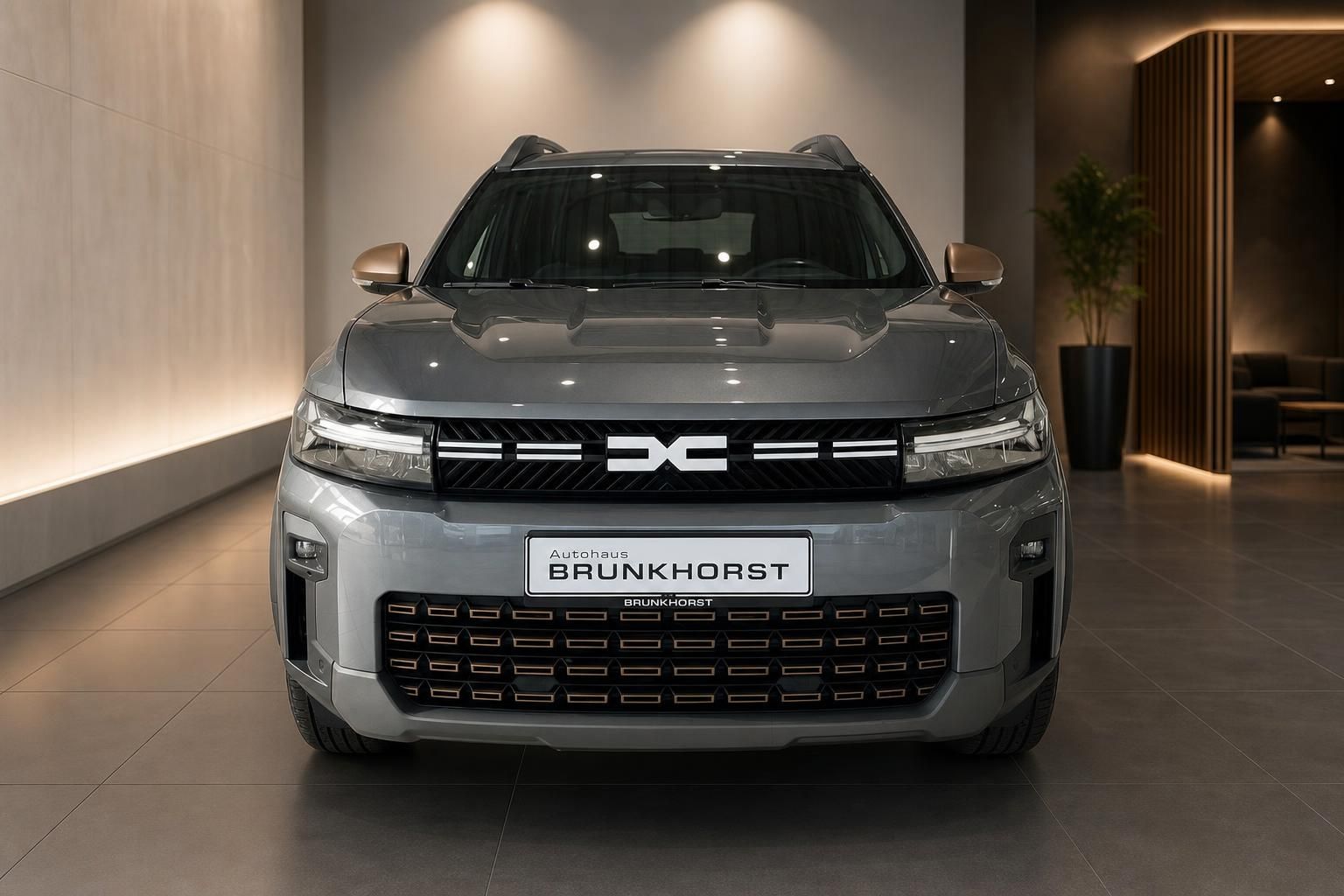 Dacia Bigster SUV grau Frontansicht - charakteristische Kühlergrill und LED-Scheinwerfer Design
