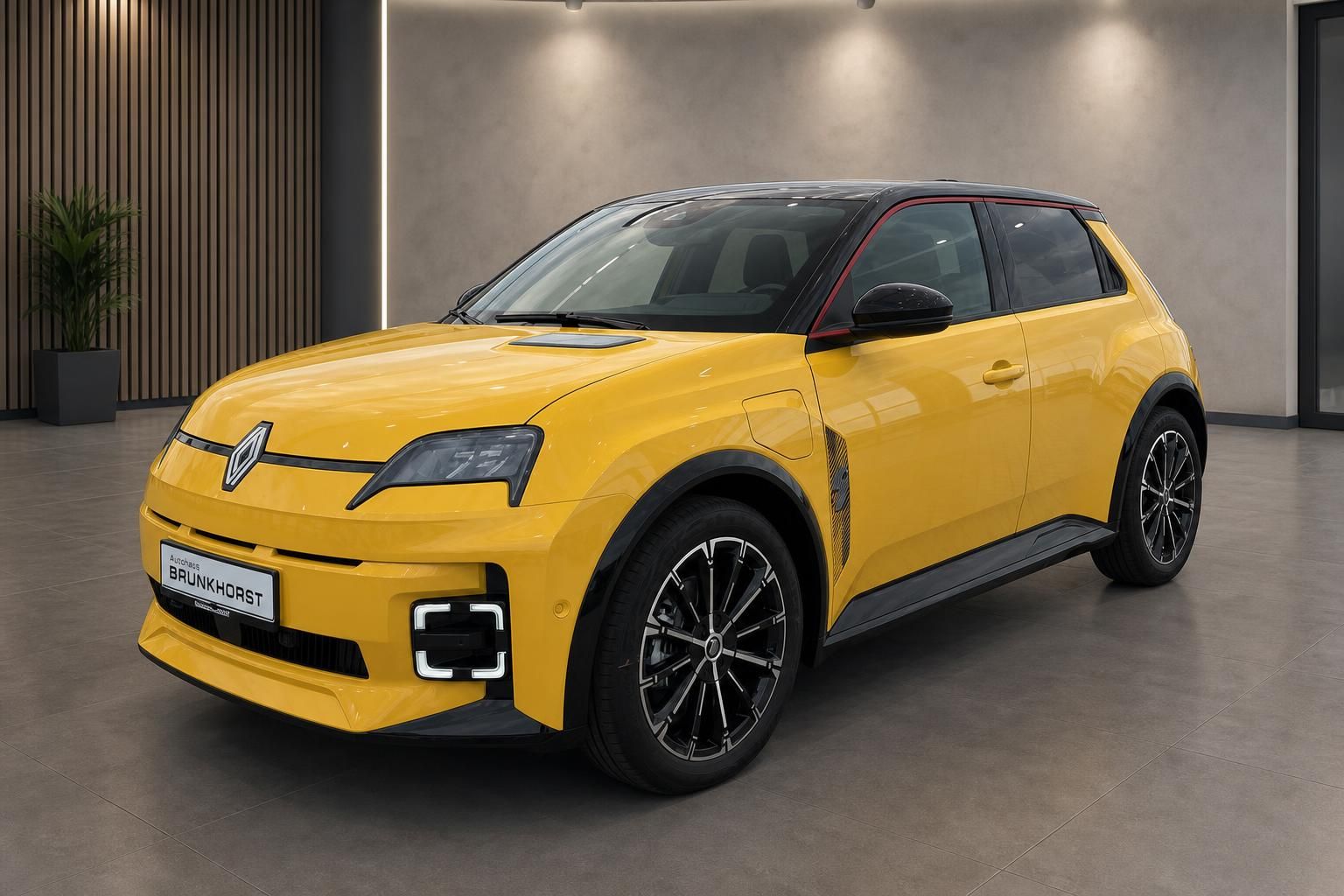 Renault 5 E-Tech Electric gelb Schrägansicht vorne links im Showroom – Autohaus Brunkhorst