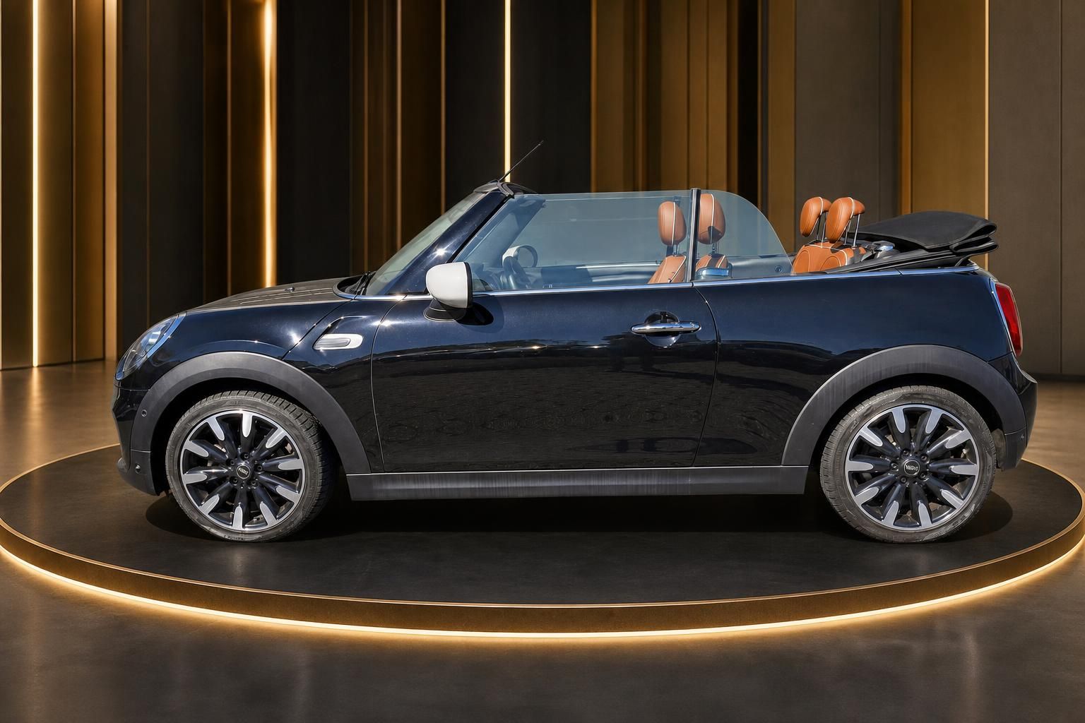 MINI Cooper Cabrio schwarz Seitenansicht mit orangenen Sitzen und weißen Außenspiegeln