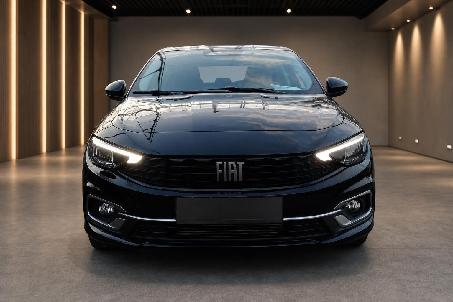 Fiat Tipo Limousine schwarz Frontansicht mit LED-Scheinwerfern im Showroom
