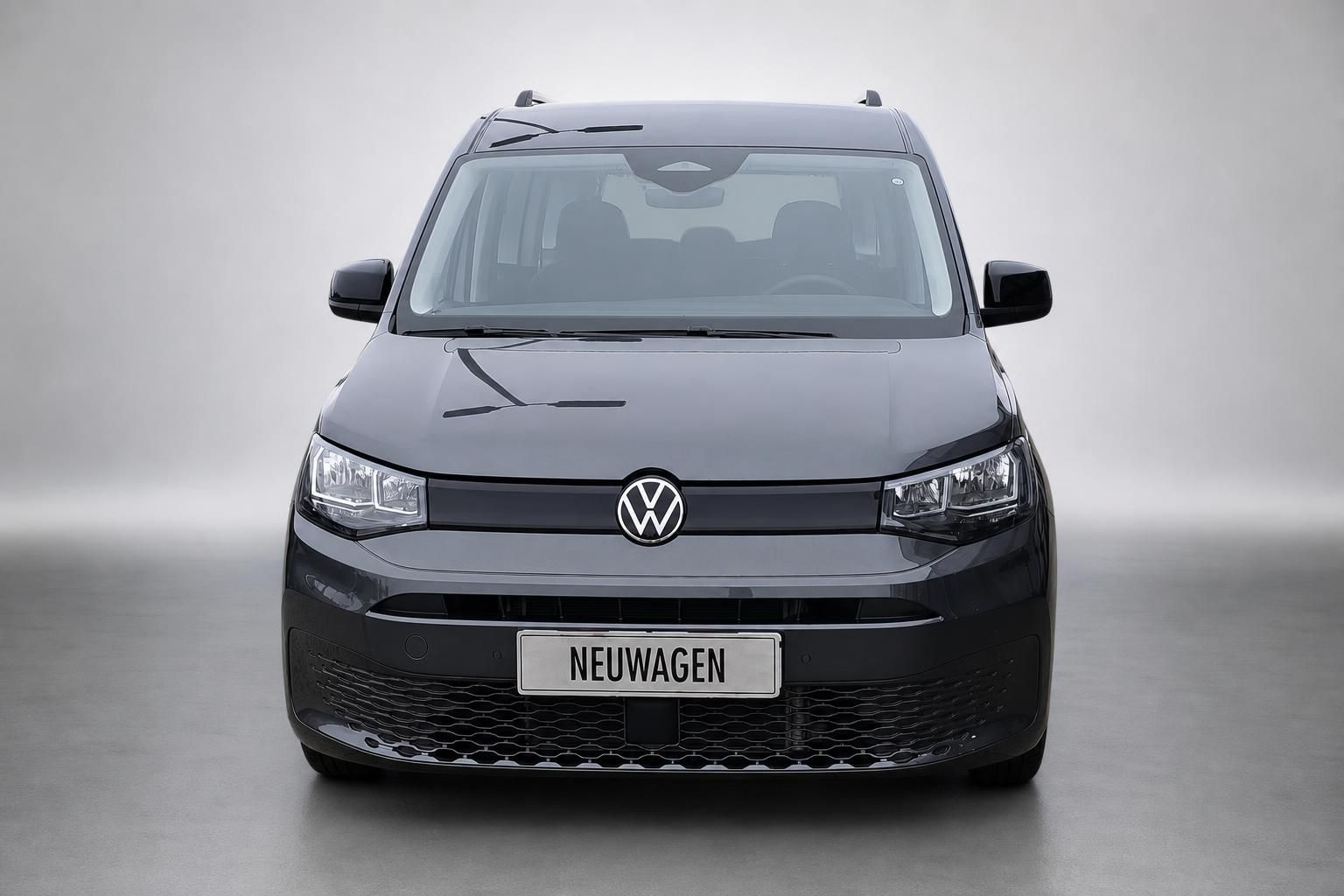 VW Caddy Frontansicht direkt, grauer Van mit VW Logo