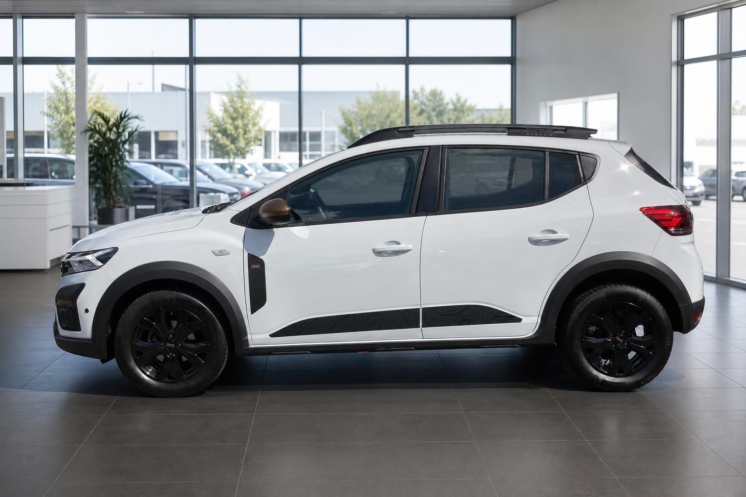 Dacia Sandero Stepway weiß Seitenansicht mit schwarzen Felgen