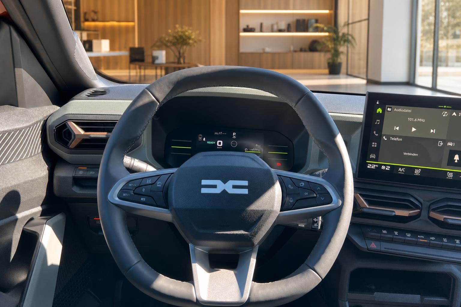 Dacia SUV Cockpit-Detail mit Lenkrad, digitalem Kombiinstrument und Infotainment-System