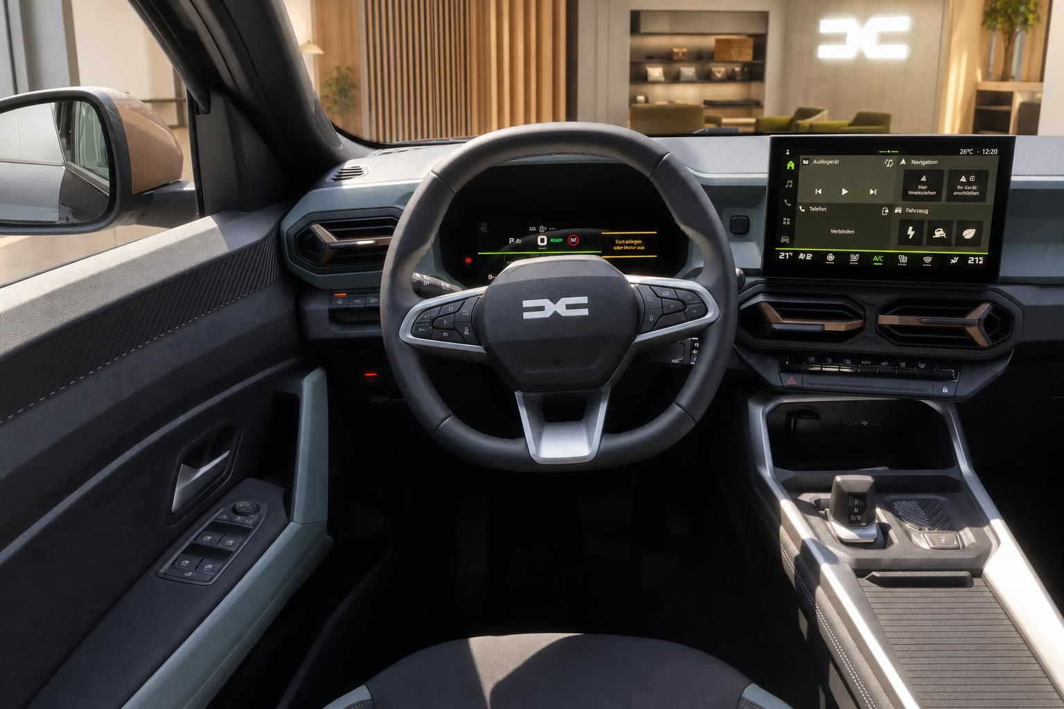 Cockpit mit Lenkrad und Touchscreen-Infotainment im Fahrzeuginnenraum