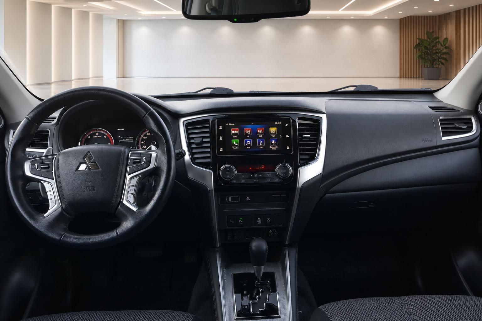 Mitsubishi L200 Innenraum - Armaturenbrett mit Touchscreen-Display und schwarzer Ausstattung