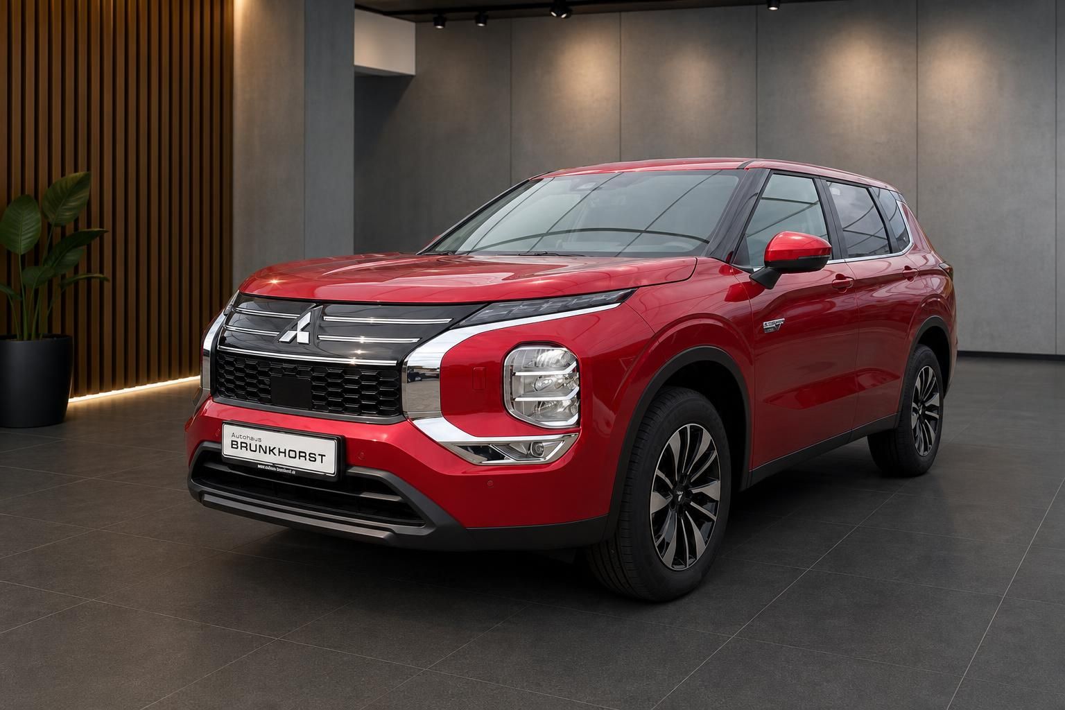 Roter Mitsubishi Outlander SUV in modernem Showroom - Schrägansicht von vorne links