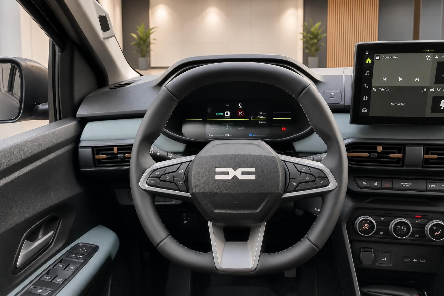 Lenkrad und Cockpit mit digitalem Kombiinstrument im Fahrzeuginnenraum