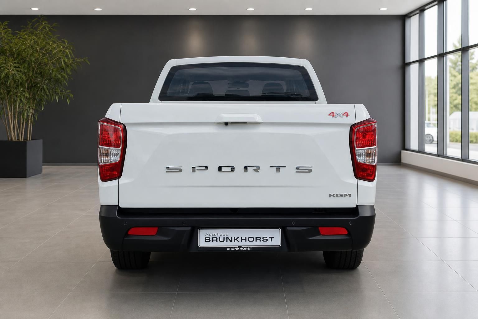 SsangYong Musso Sports Pick-up weiß - Heckansicht mit Ladefläche und 4x4 Allradantrieb Kennzeichnung