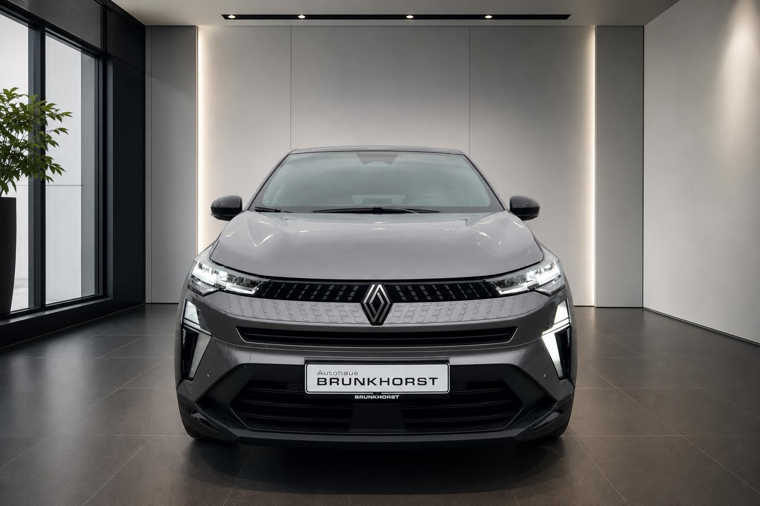 Renault Captur Frontansicht in grau mit LED-Scheinwerfern und charakteristischem Kühlergrill