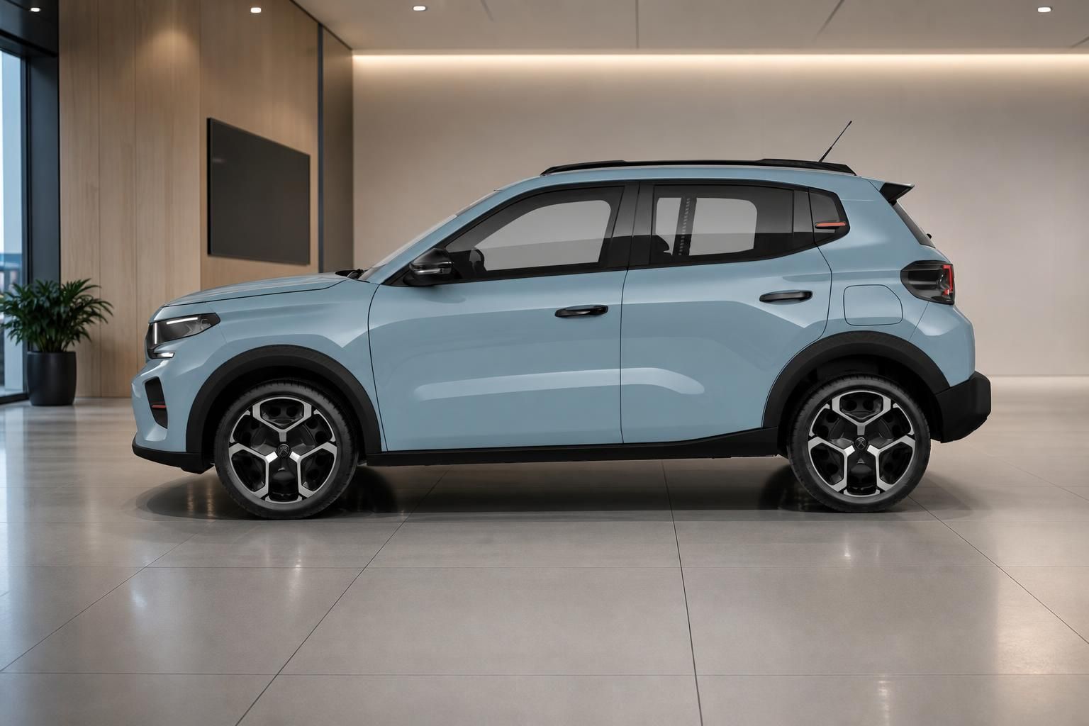 Citroën ë-C3 in Blau, Seitenansicht im modernen Showroom