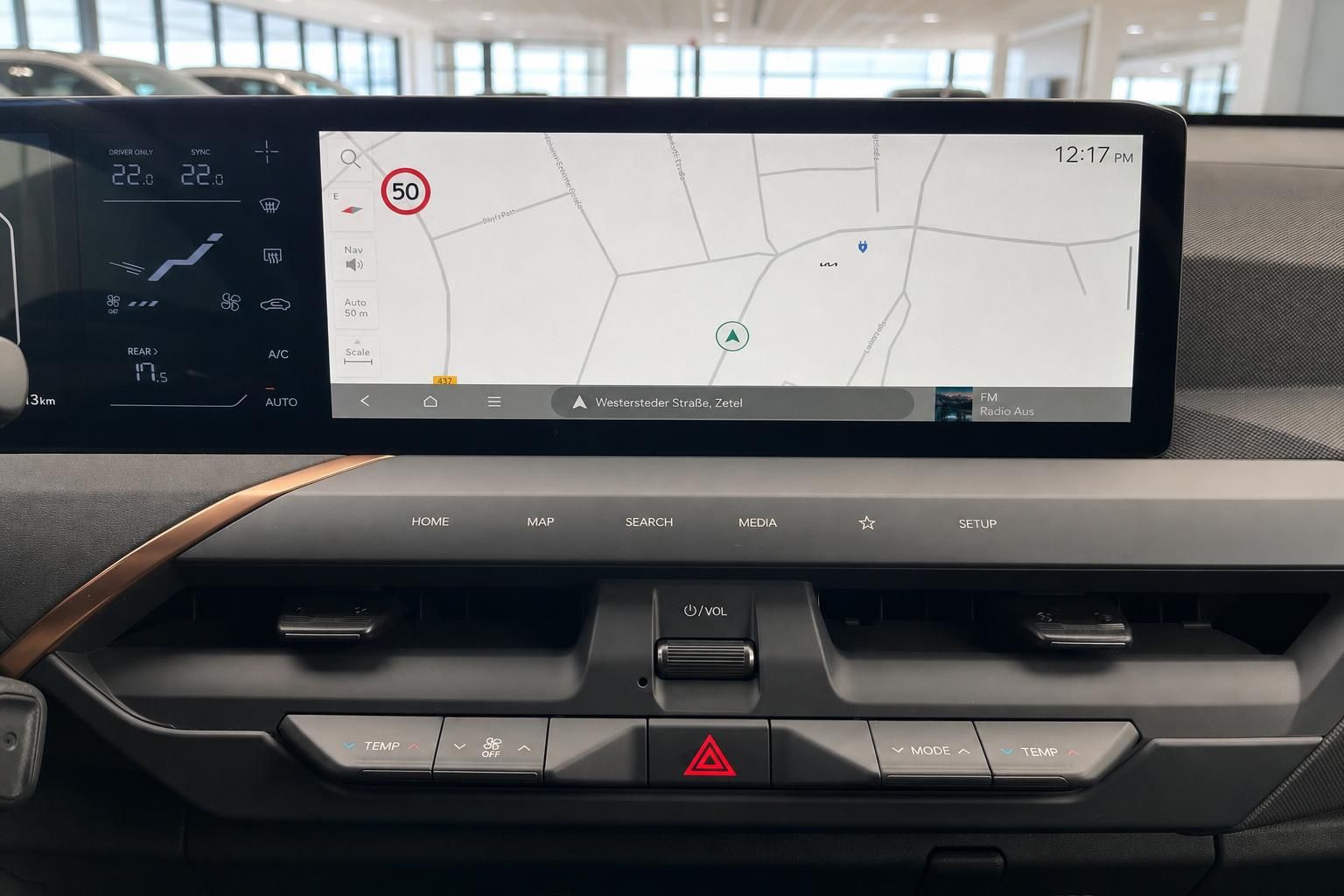 Kia EV5 Infotainment Display mit Navigationskarte und Klimabedienung
