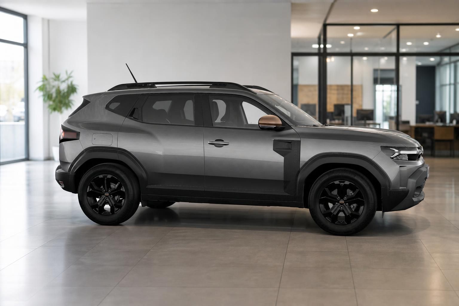 Dacia Duster grau metallic, Seitenansicht im Showroom