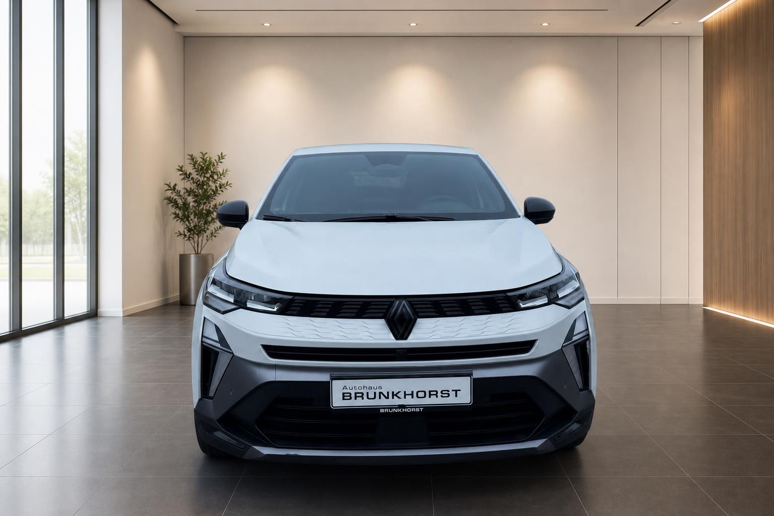 Renault Symbioz Frontansicht in weiß mit markanter LED-Beleuchtung und Autohaus Brunkhorst Kennzeichen