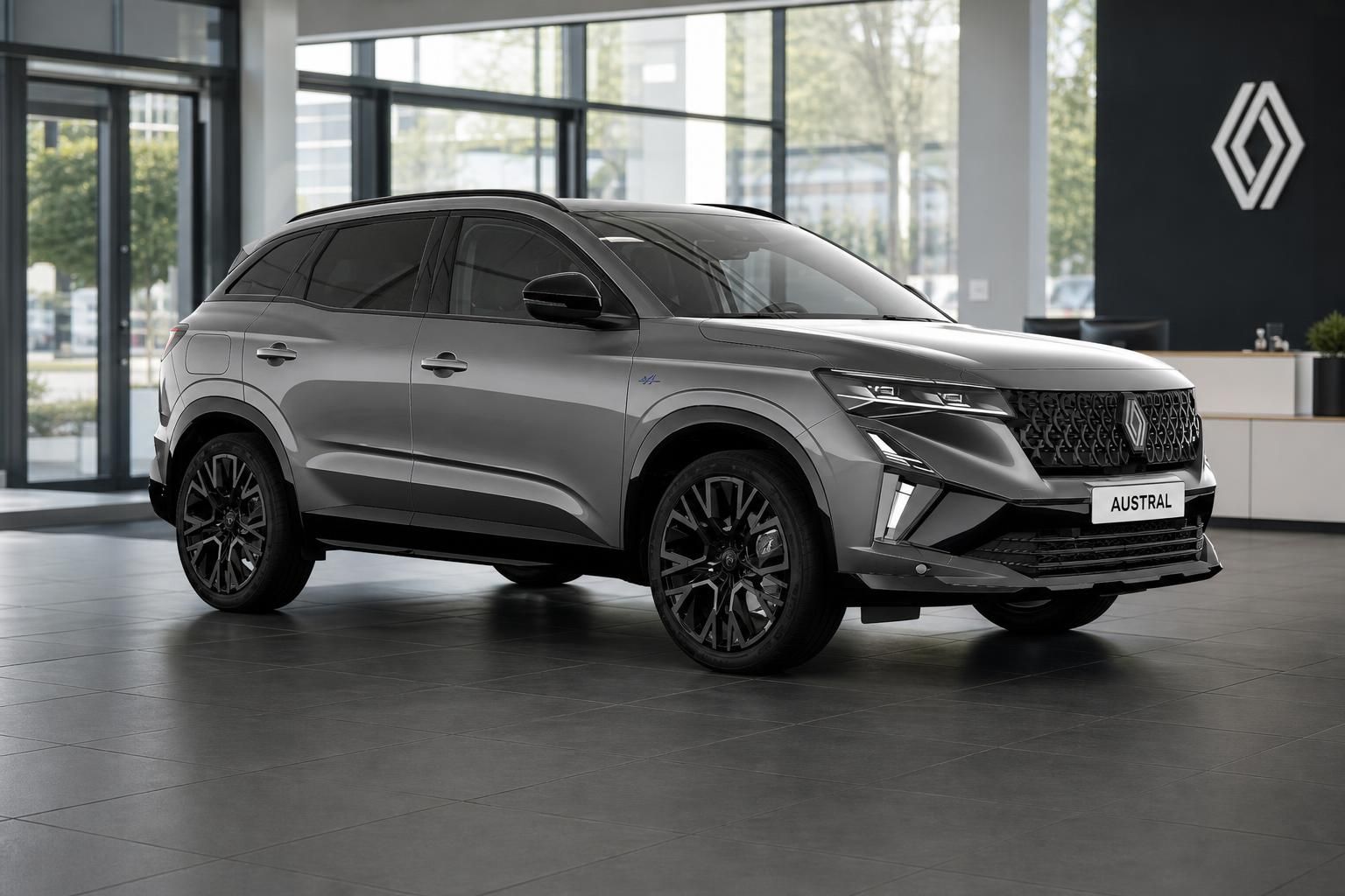 Renault Austral in Grau, Frontansicht im Autohaus Showroom