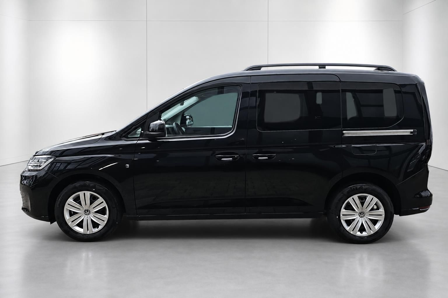 VW Caddy schwarz, Seitenansicht im Profil