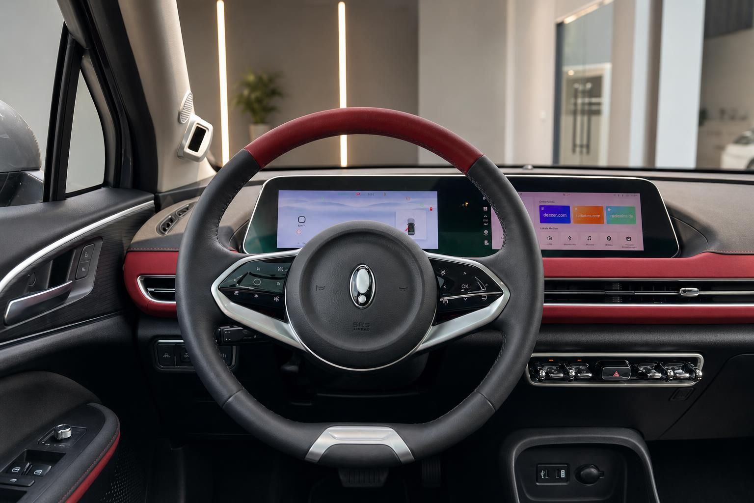 Cockpit mit Lederlenkrad und digitalem Display in Rot-Schwarz
