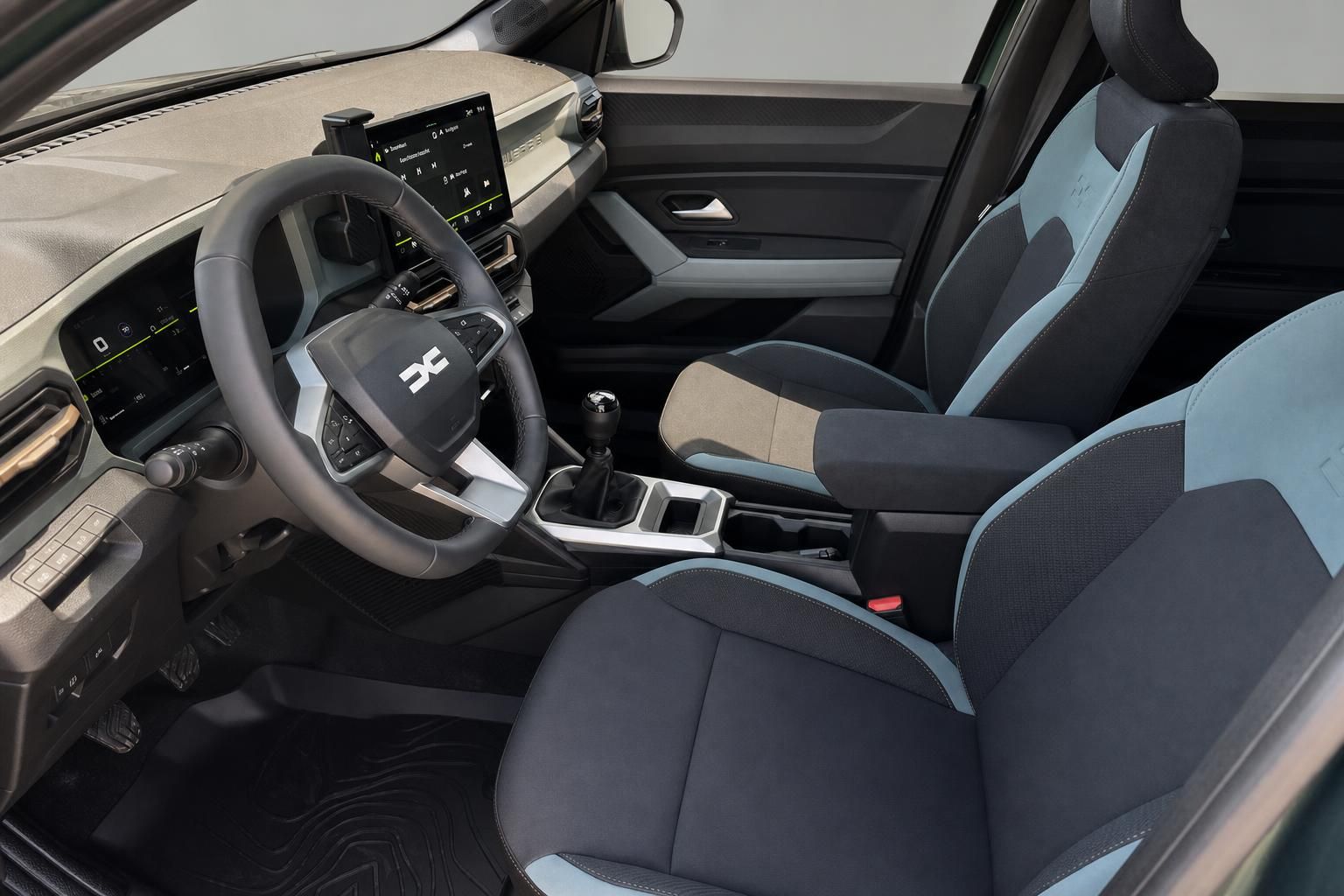 Dacia Duster Innenraum mit Fahrersitz, Lenkrad und blau-schwarzer Polsterung