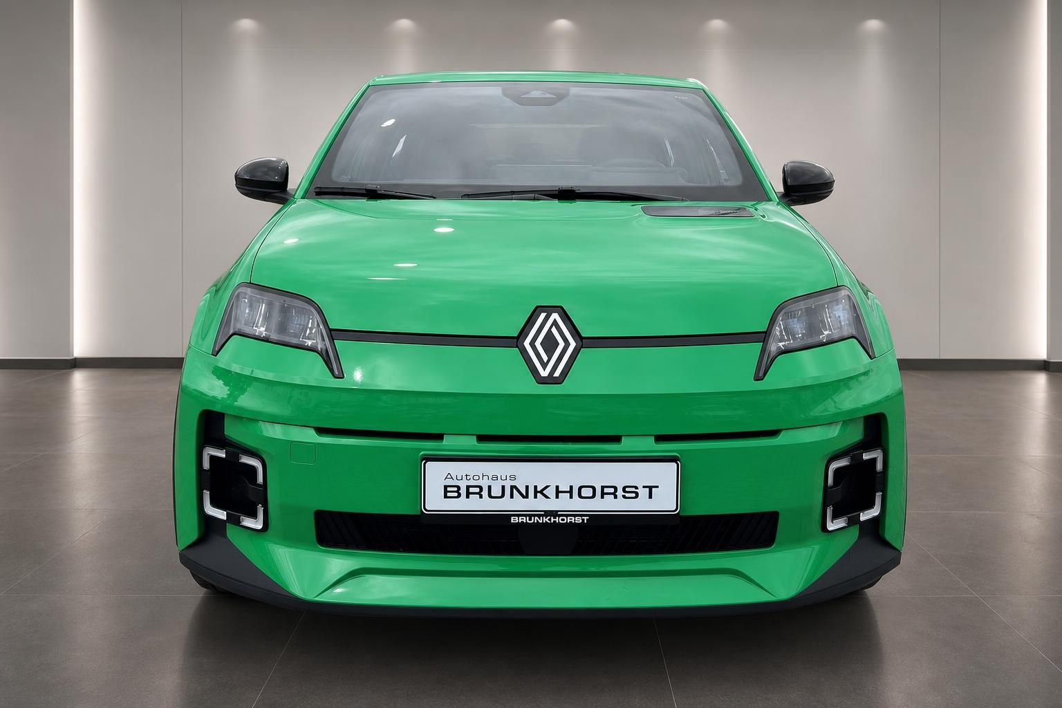 Grüner Renault Elektro-Kompaktwagen Frontansicht - Moderne LED-Scheinwerfer und Renault-Logo